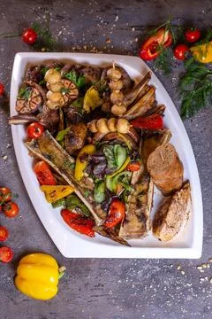 A set of different beef meat dishes on a white plate Stock Photos
