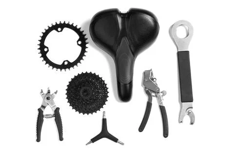 Set of different bicycle tools and parts on white background, flat lay Stock Photos