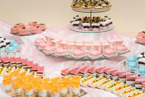 Set of different cakes sweets and desserts arranged on one plate. Party candy Stock Photos