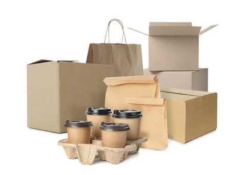 Set with different cardboard boxes, paper bags and takeaway cups on white bac Stock Photos
