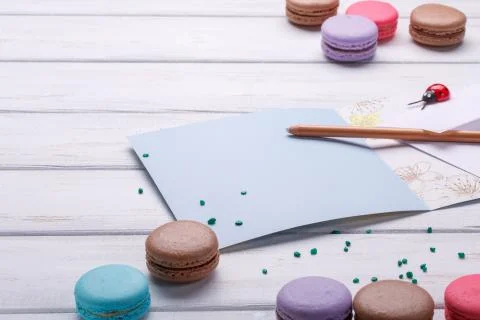 Set of different colorful macaroons Placed over a white wooden background, A  Foto stock