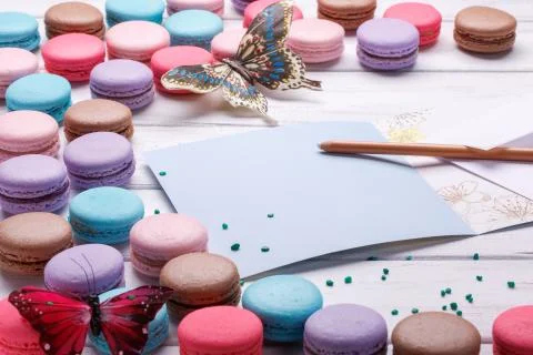 Set of different colorful macaroons Placed over a white wooden background, A  Stock Photos