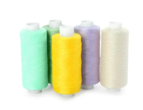 Set of different colorful sewing threads on white background Stock Photos