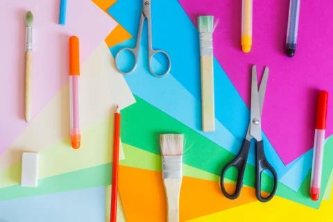 Set of different colors felt-tip pens, pencils, brushes and colored paper Stock Photos