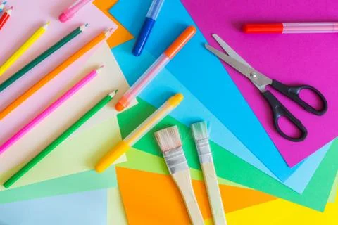 Set of different colors felt-tip pens, pencils, brushes and colored paper Stock Photos