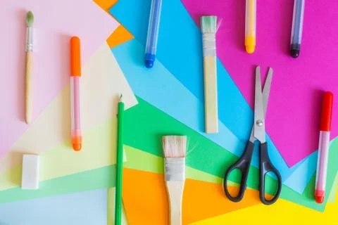 Set of different colors felt-tip pens, pencils, brushes and colored paper Stock Photos