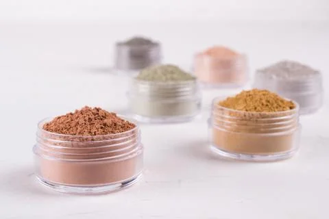 Set of different cosmetic clay mud powders on white background Stock-Fotos