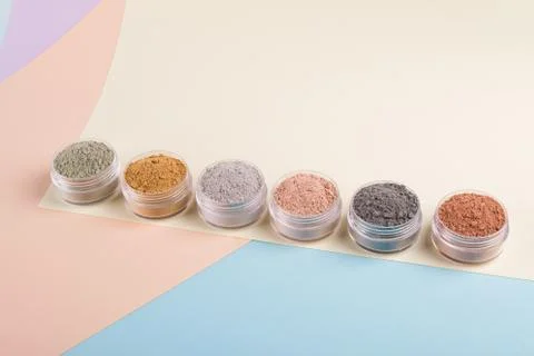 Set of different cosmetic clay mud powders on white background Stock Photos