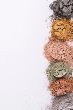 Set of different cosmetic clay mud powders on white background Stock Photos