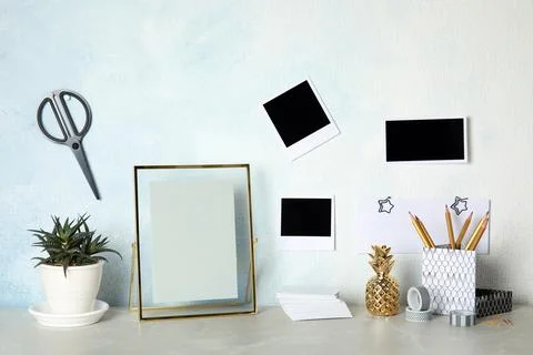 Set of different decorative elements on table against color wall. DIY blogger Stock Photos