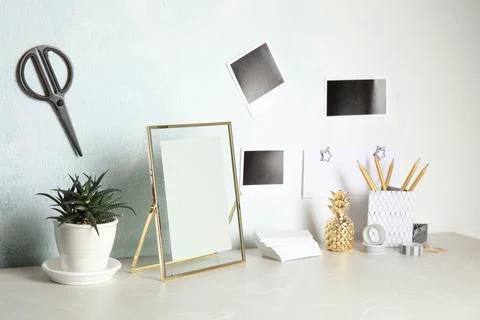 Set of different decorative elements on table against color wall. DIY blogger Stock Photos