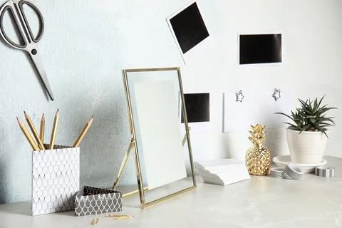 Set of different decorative elements on table against color wall. DIY blogger Stock Photos