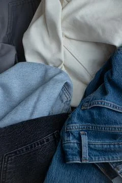 Set of different denim pants Stock Photos