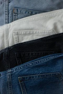 Set of different denim pants Stock Photos