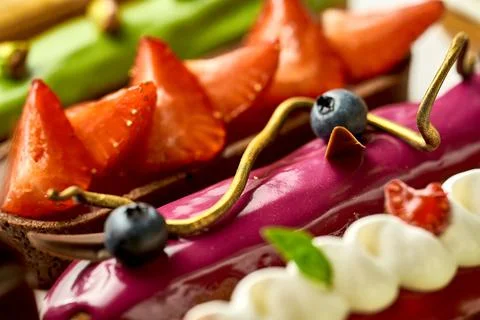 A set of different eclairs with filling. Selective focus, close-up Stock Photos