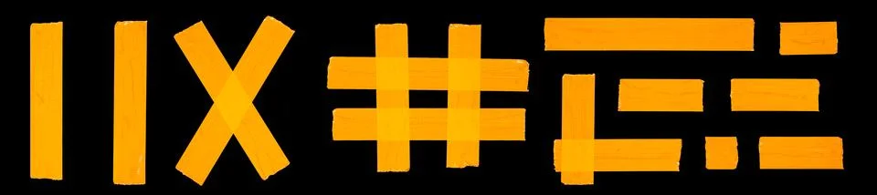 A set of different forms of orange adhesive tape isolated on a black Stock Photos