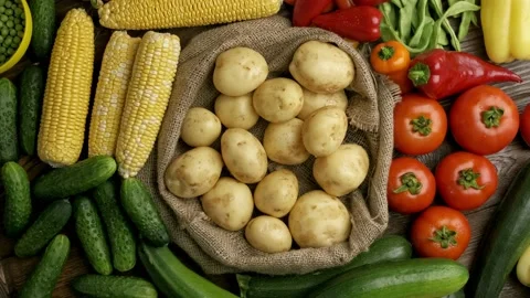 Set of different fresh raw vegetables in the wooden tray, wood background, top Stock Footage 157687202