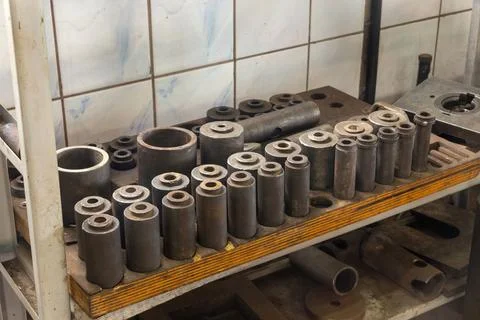Set of different instruments on shelves in big workshop. Stock Photos
