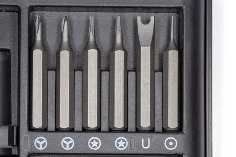Set of different interchangeable bits for screwdriver in case, top view Foto stock