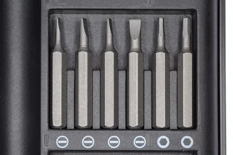 Set of different interchangeable bits for screwdriver in case, top view Stockfoto's