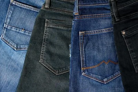 Set of different jeans and pockets in the clothes store Stock Photos