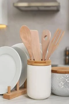Set of different kitchenware on white table at home Stock Photos