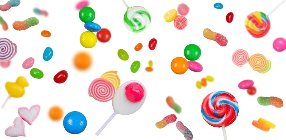 Set of different many candies falling on a white background.  Stock Photos
