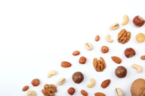 Set of different nuts on a light background. Stock-Fotos