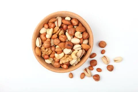 Set of different nuts on a light background. Stock Photos