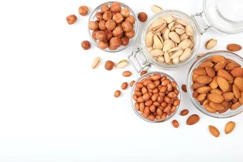 Set of different nuts on a light background. Stock Photos
