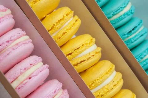 Set of different pastel macaroons in paper boxes Stock Photos