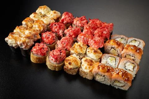 Set of different rolls on a black background Stock Photos