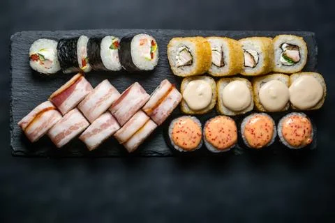 Set of different rolls on on a dark background horizontal Stock Photos