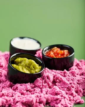 Set of different sauces - salsa, guacamole and ranch in black small sauce boa Stock Photos