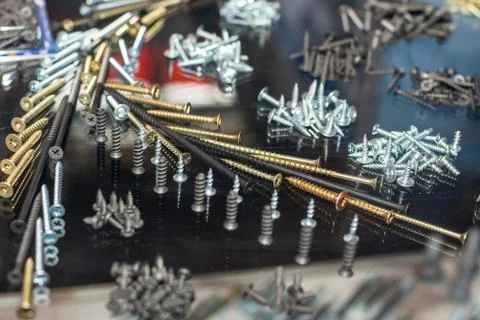 Set of different screws, nails, self-tapping screws and other metal parts for Stock Photos