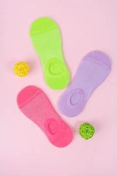 Set of different short socks on pink background Stock Photos