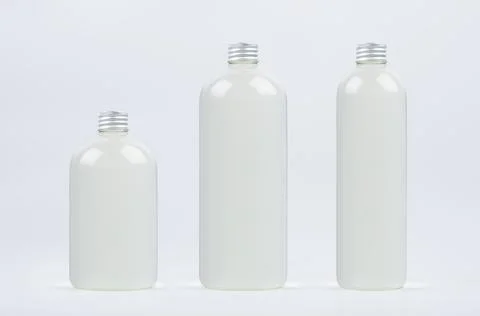 Set of different size plastic tall, low and thick bottles with water, silver  Stock Photos