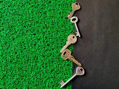 Set of different sizes of house keys or shop keys in zig zag position. Isolat Stock Photos