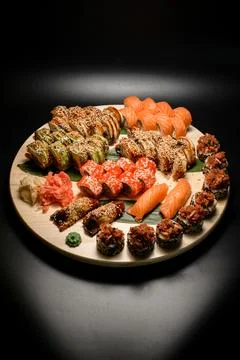 Set of different sushi rolls with different types of fish served with banana Foto stock