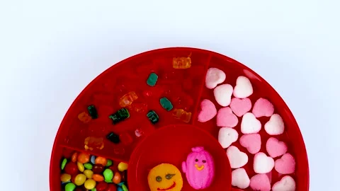 Set of different tasty candies in a red candy box isolated on white background Stock Footage 249977989
