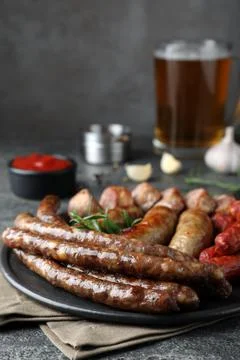 Set of different tasty snacks on dark grey table, closeup Stock Photos