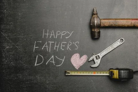 Set of different tools on dark background.A concept for Father's Day. Top vie Stock Photos