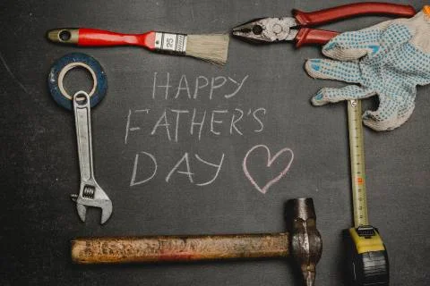 Set of different tools on dark background.A concept for Father's Day. Top vie Stock Photos
