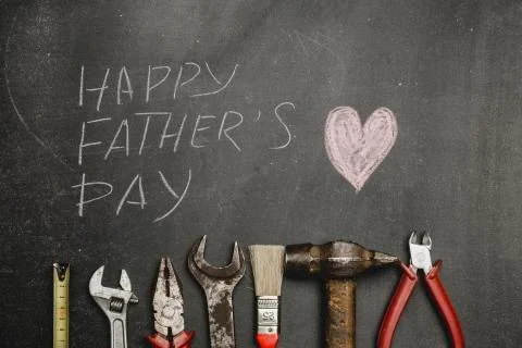 Set of different tools on dark background.A concept for Father's Day. Top vie Stock Photos