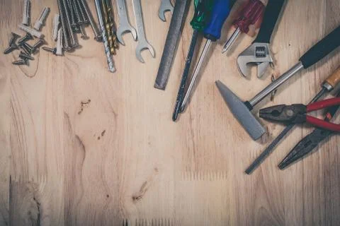 Set of different tools on wooden background Foto stock