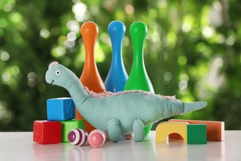 Set of different toys on table against blurred background Foto stock