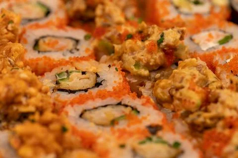 A set of different types of rolls in a box. Top view of various portions of v Stock Photos