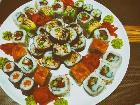 Set of different types of rolls on a white plate. Traditional Japanese Dish 库存照片