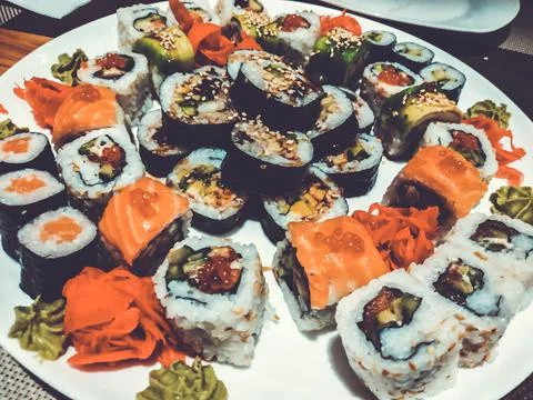 Set of different types of rolls on a white plate. Traditional Japanese Dish 库存照片