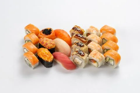 Set of different types of sushi maki, nigiri and gunkans on a neutral light b Stock Photos